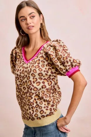 Leopard pattern puff sleeve V-neck sweater top by Trendsi, featuring a stylish design and cozy fit in soft fabric.