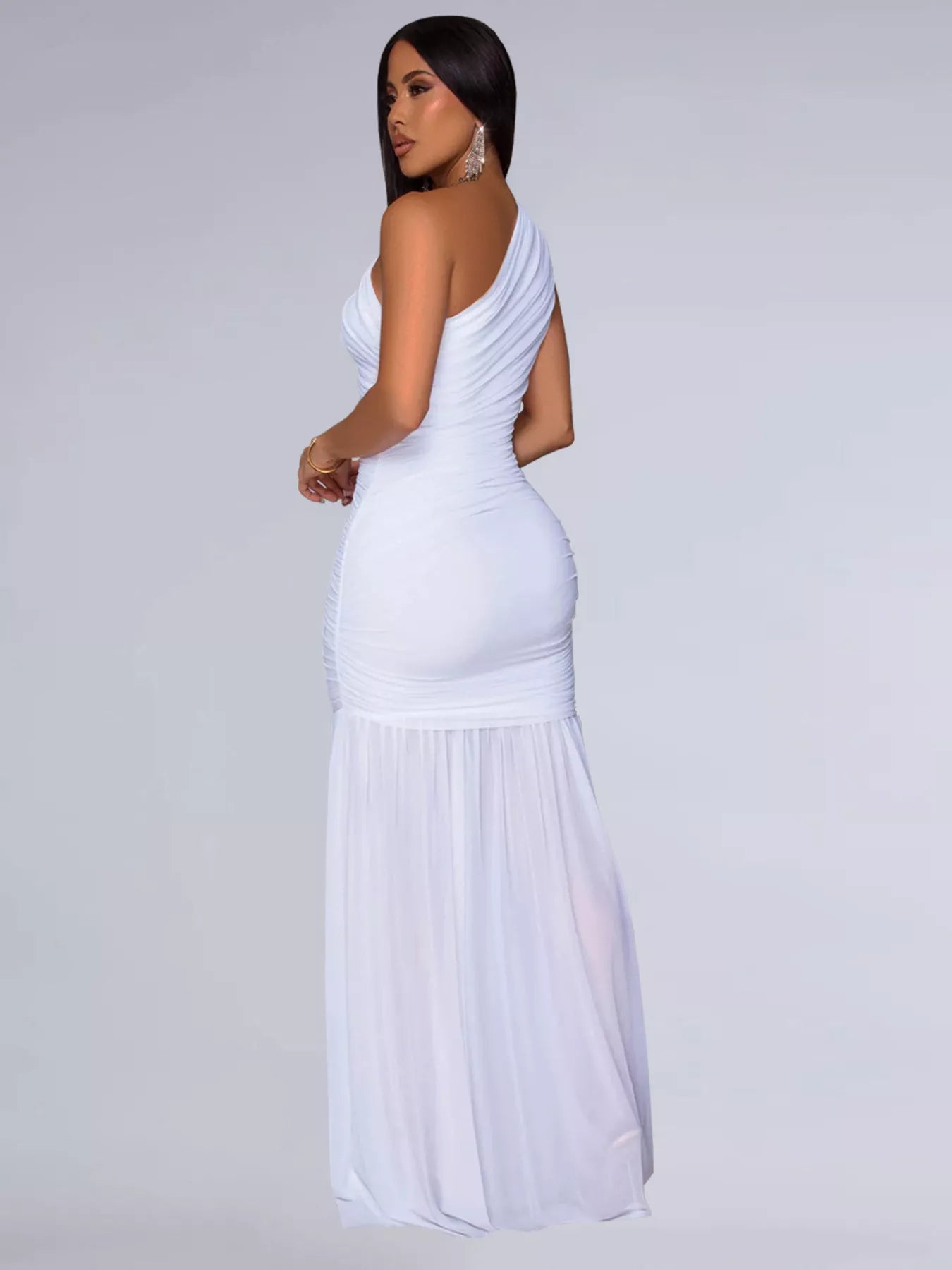 Black one-shoulder ruched bodycon maxi dress by Trendsi, featuring a fitted silhouette and elegant off-shoulder design.