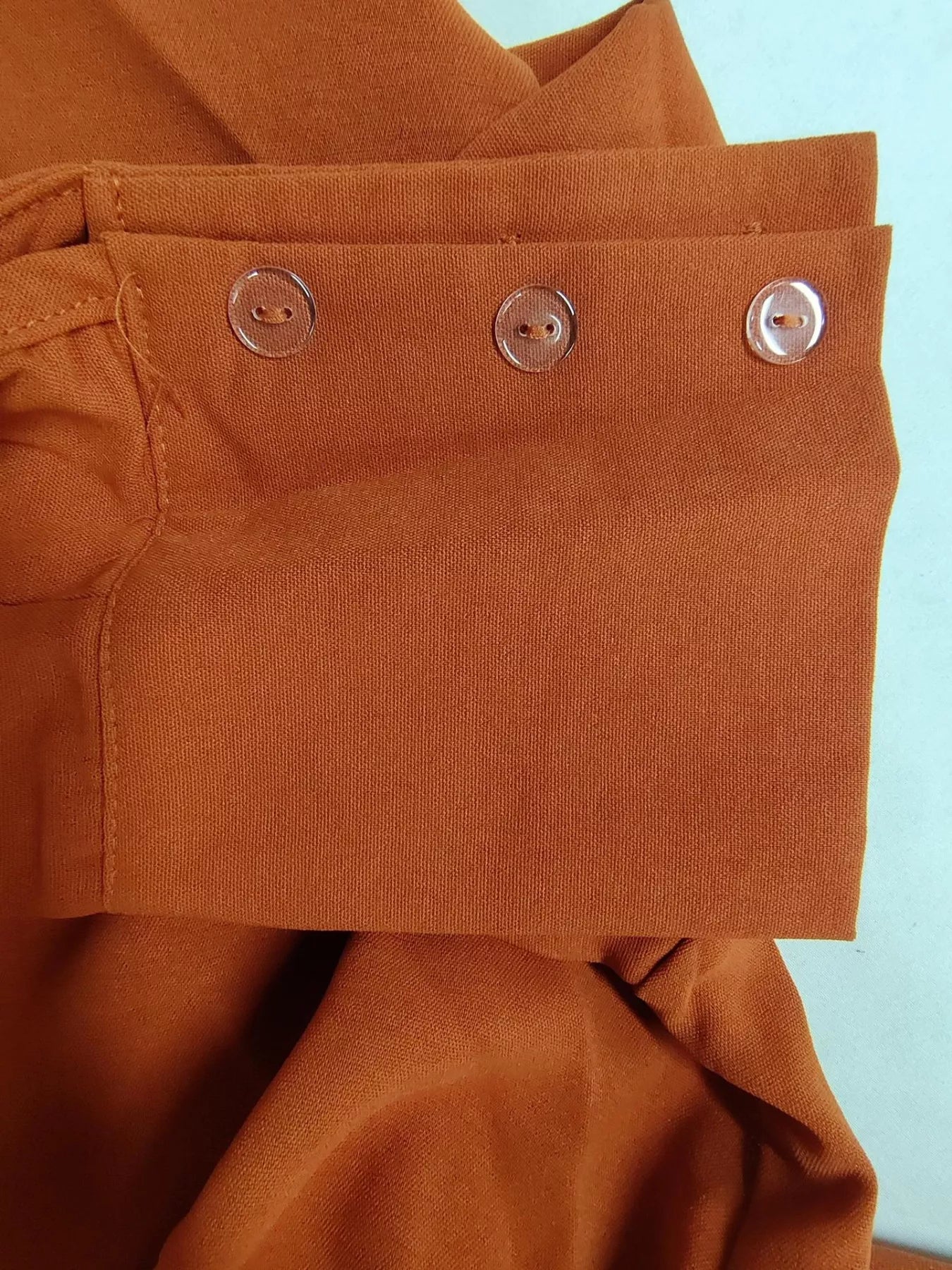 Button front shirt and pocketed wide-leg pants set by Trendsi, featuring a casual, stylish look with a coordinated top and pants.