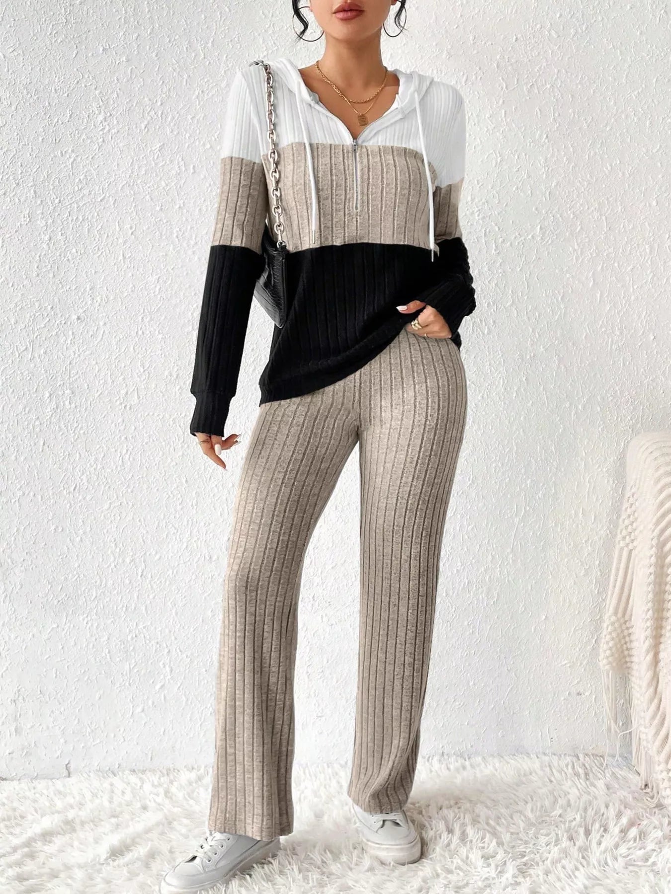 Color block half zip hooded top and matching pants set by Trendsi, featuring vibrant color blocking on the casual loungewear outfit.