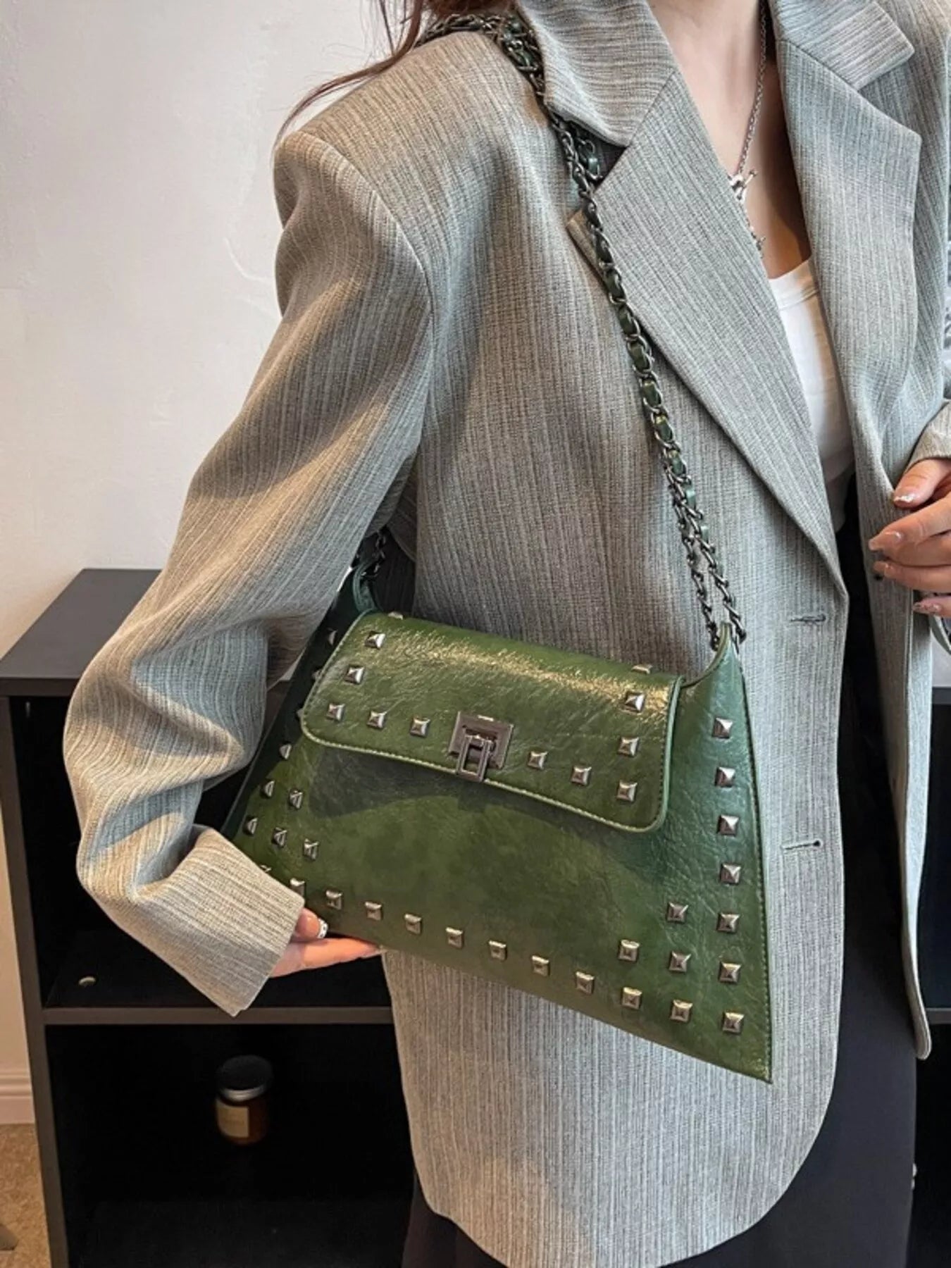Black studded flap chain shoulder handbag with adjustable strap and silver hardware from Trendsi.