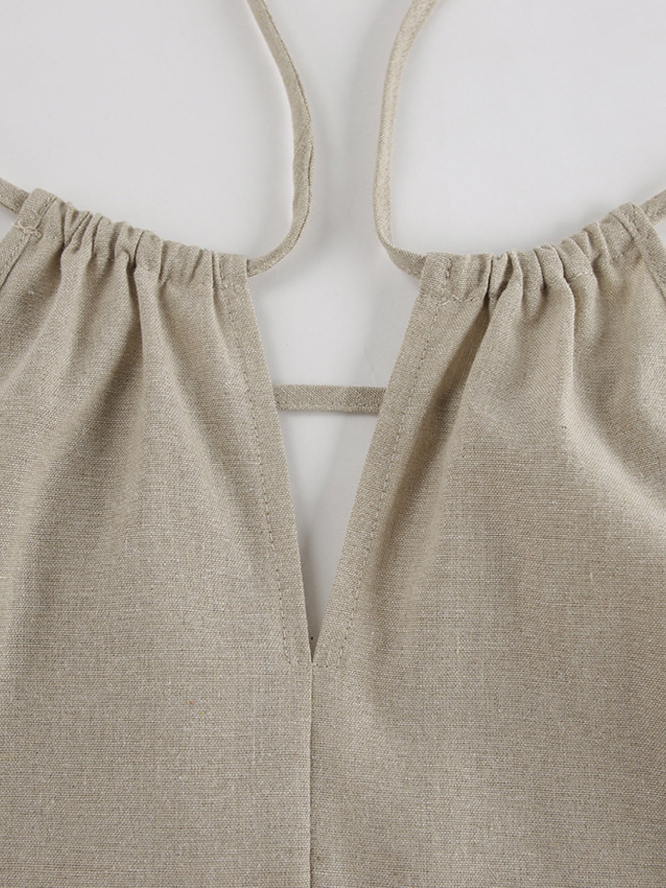 Trendsi cutout tank top and wide-leg pants set, featuring a stylish sleeveless top with cutout details and flowy high-waisted pants.