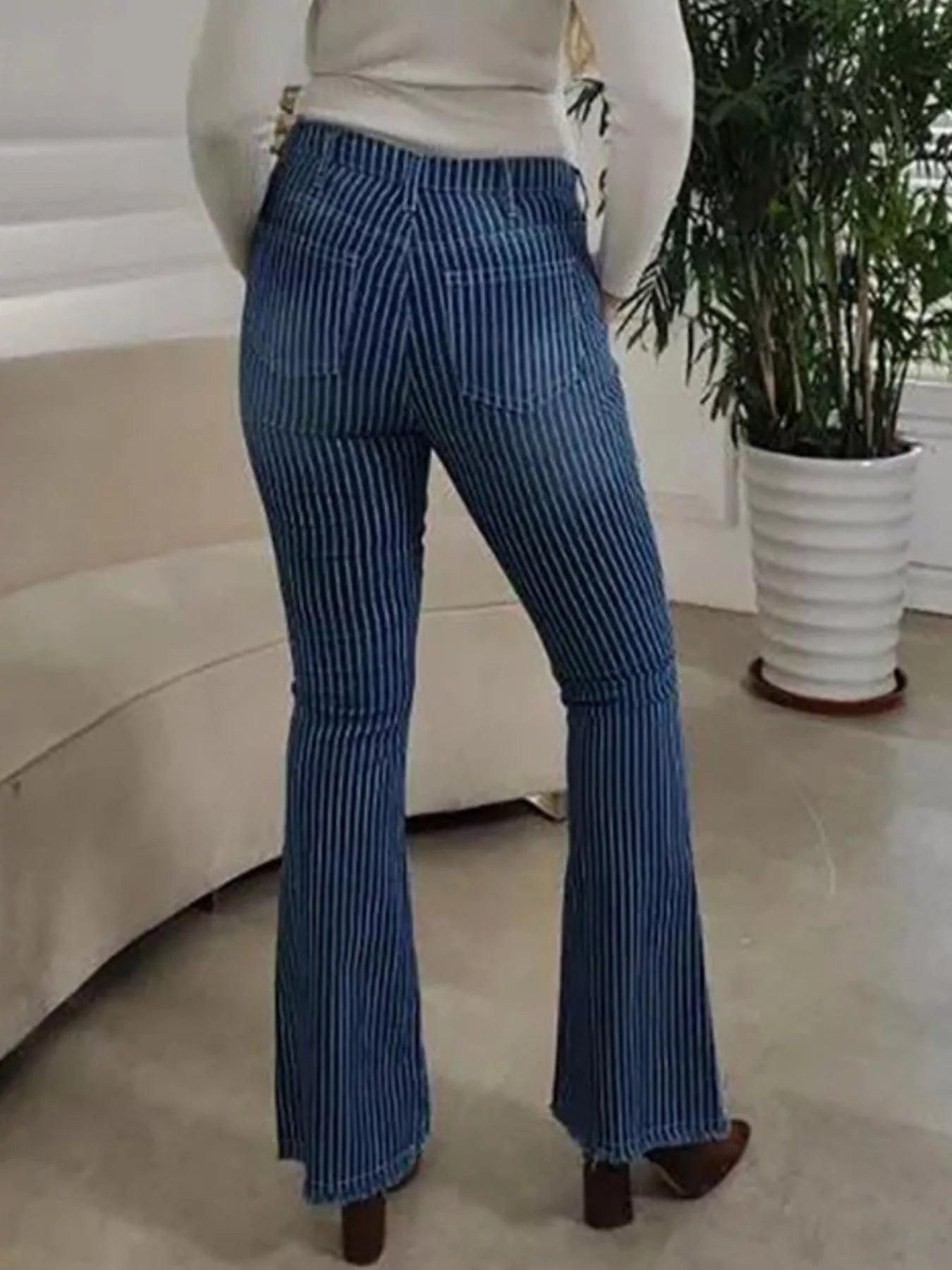 Striped button fly flare jeans in denim with a high waist and flared legs, featuring bold stripe patterns from Trendsi.
