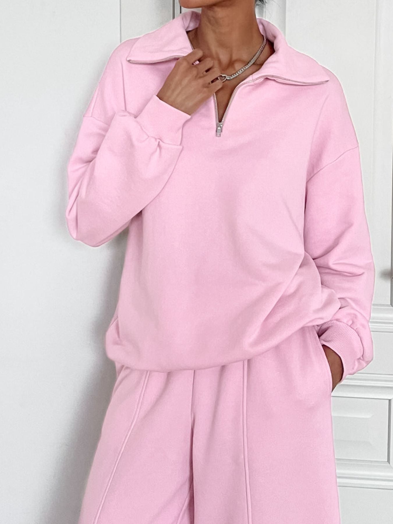 Trendsi quarter zip long sleeve top and matching pants set, stylish casual wear with a comfortable fit, shown in dark color.