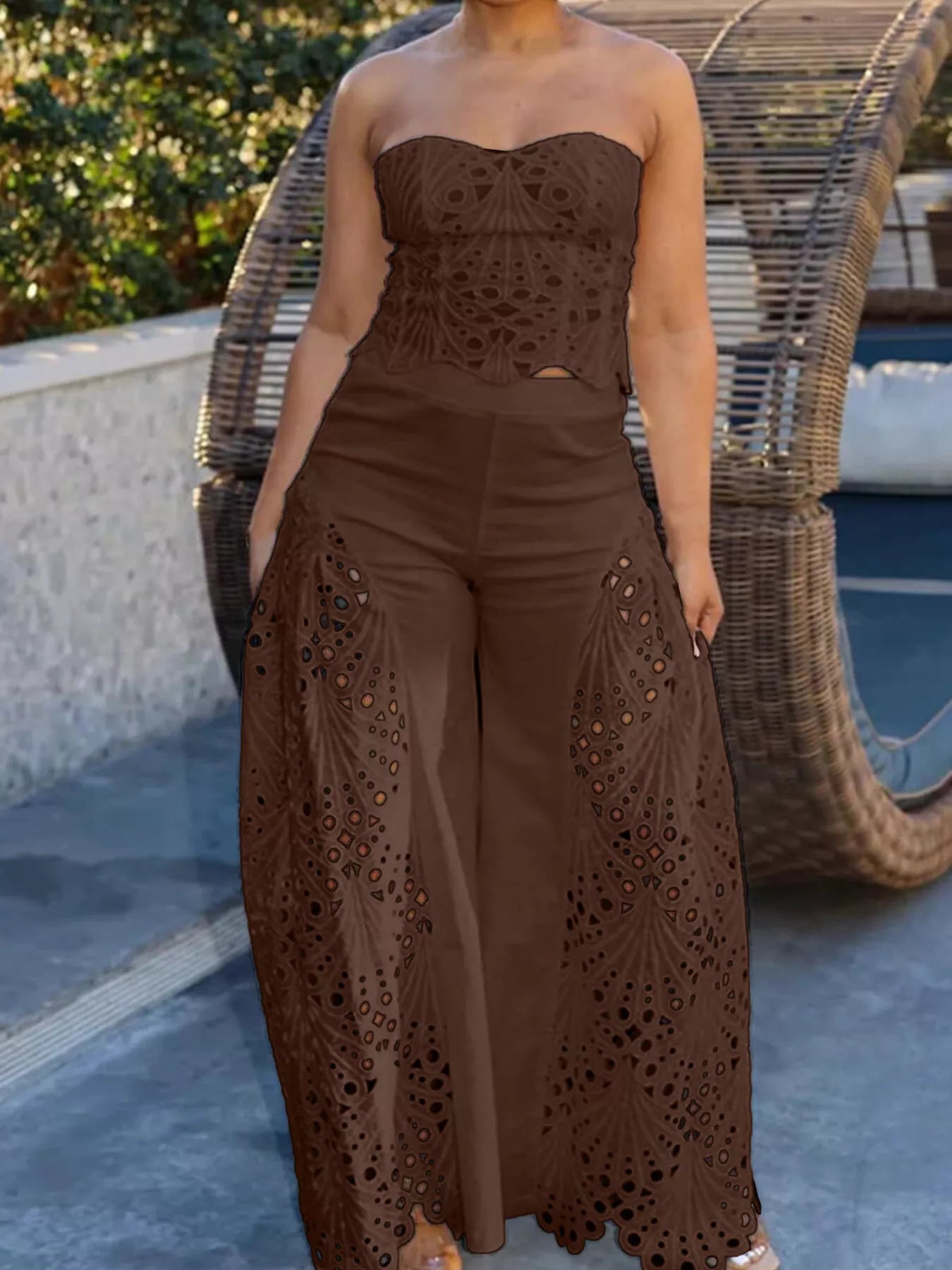 Hollow-out tube top and pants set by Trendsi, stylish 2-piece outfit with cut-out details, perfect for trendy casual wear.