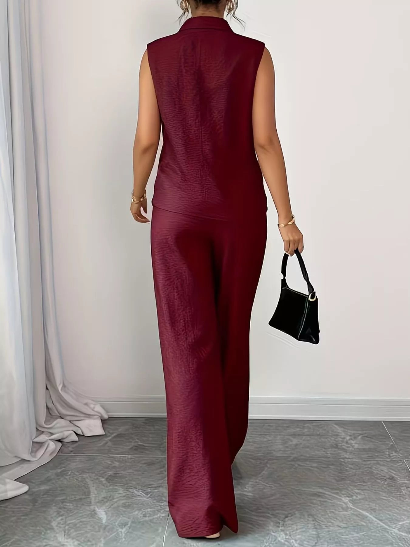 V-neck sleeveless top and wide-leg pants set by Trendsi, featuring a stylish, comfortable matching outfit with a relaxed fit.