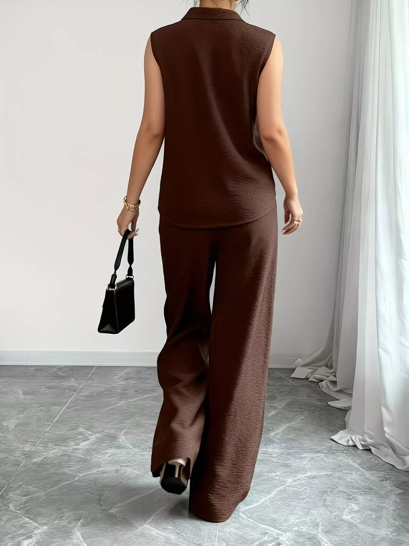 V-neck sleeveless top with wide-leg pants set by Trendsi, featuring a stylish, casual look in a light fabric.