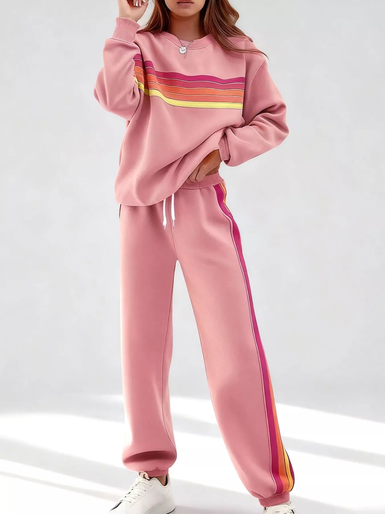 Striped round neck sweatshirt and pants set by Trendsi, featuring a comfortable fit and casual style in a matching design.