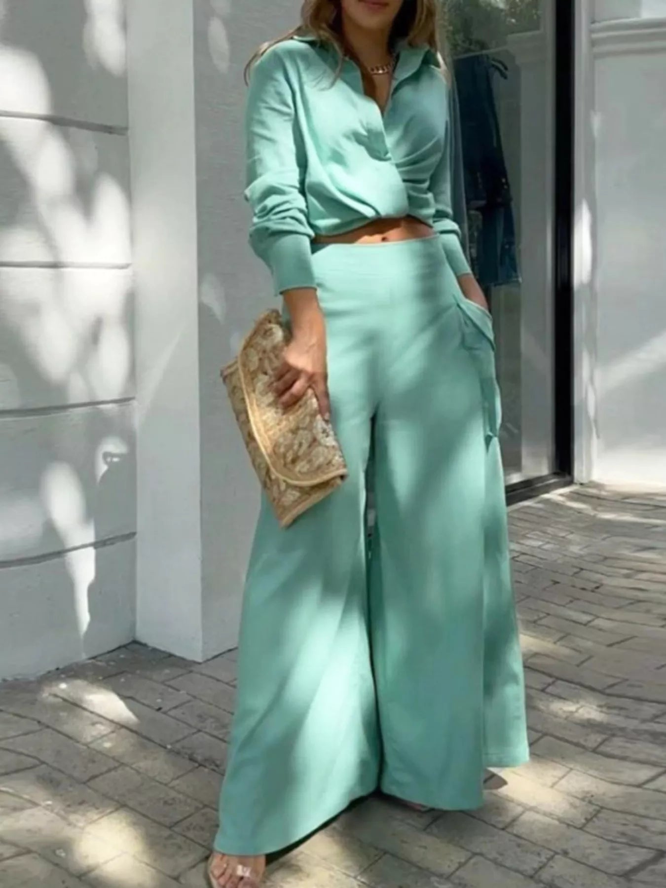 Trendsi button front shirt with pocketed wide-leg pants set, featuring a stylish blouse and flowy pants in a coordinated outfit.