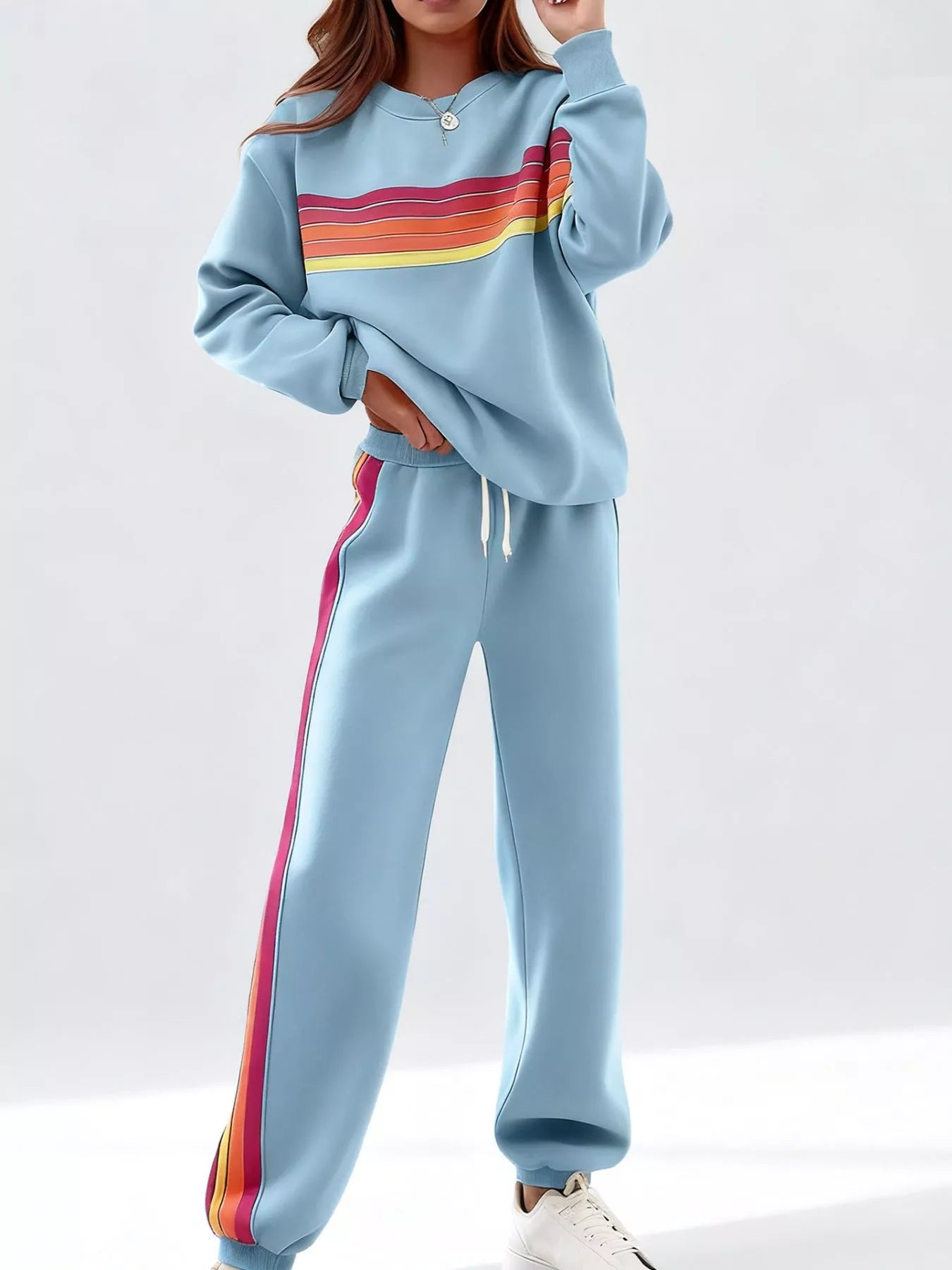 Striped round neck sweatshirt and pants set by Trendsi, casual loungewear with horizontal stripe pattern, comfortable and stylish fit.