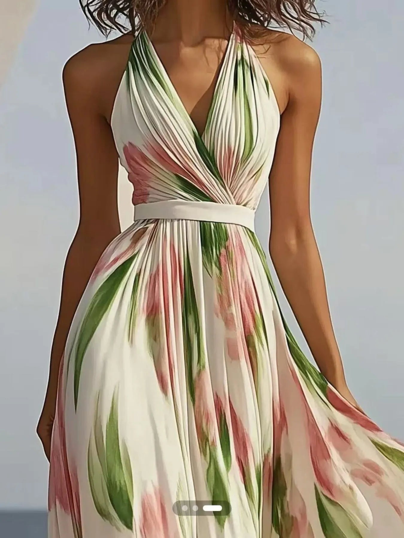 Floral print halter neck maxi dress by Trendsi with flowing fabric and vibrant floral pattern, suitable for summer or special occasions.