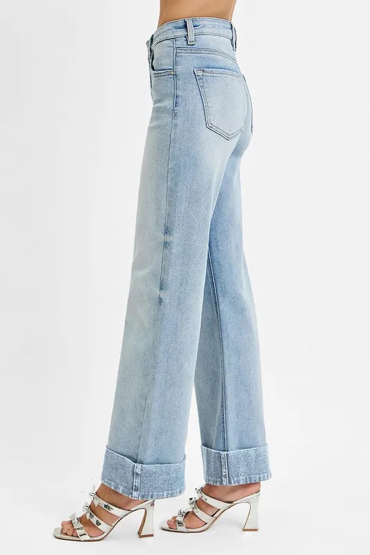 Wide cuffed high-rise ankle jeans in denim featuring a relaxed fit and trendy style, shown in a natural pose.