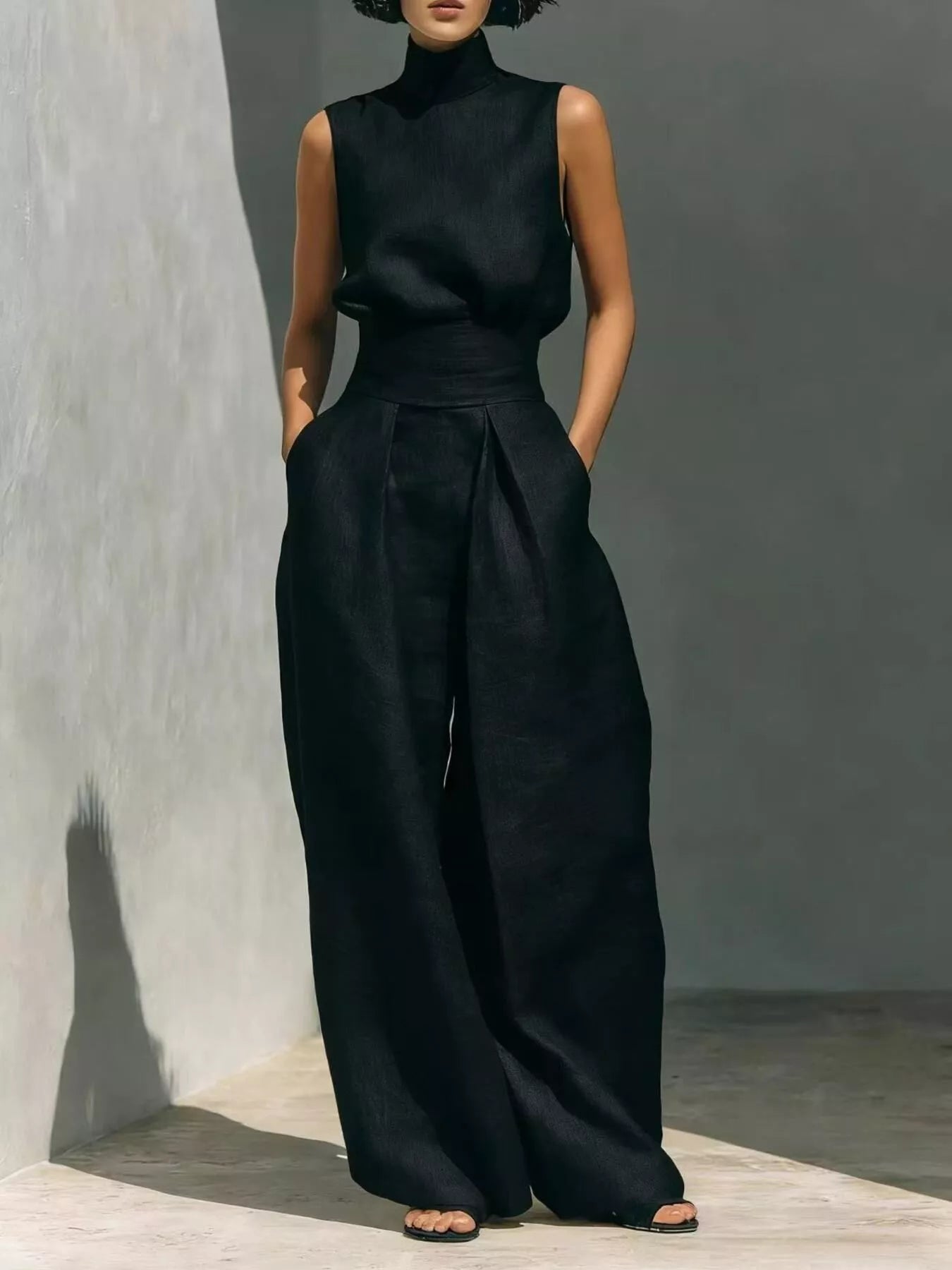 High neck sleeveless top and wide-leg pants set by Trendsi, stylish 2-piece outfit featuring a modern, elegant design.