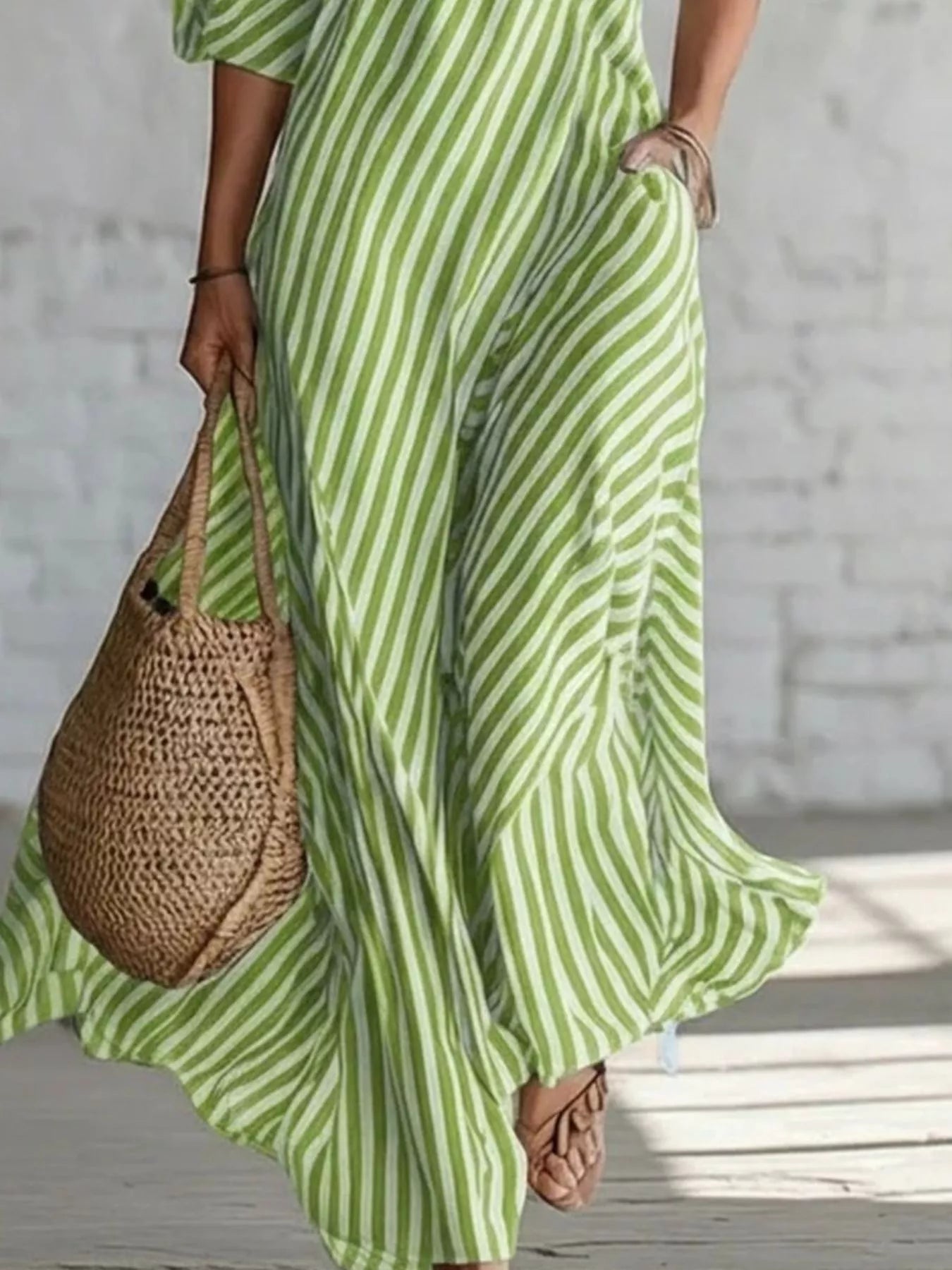 Striped one-shoulder maxi dress from Trendsi featuring a flowing design and bold vertical stripes for a stylish look.