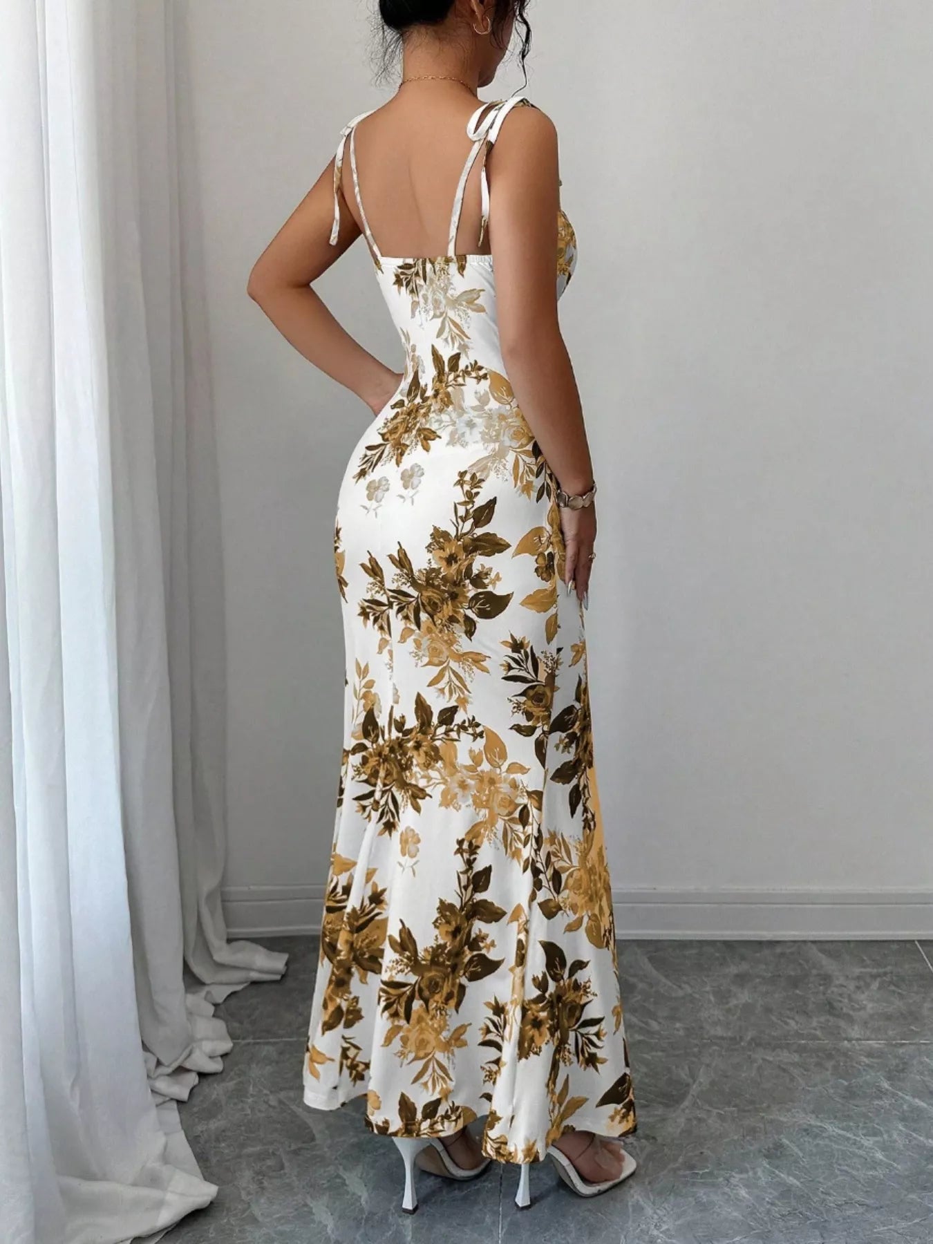 Printed tie strap slit maxi dress by Trendsi, featuring a flowy design with adjustable straps and a high slit, perfect for summer wear.
