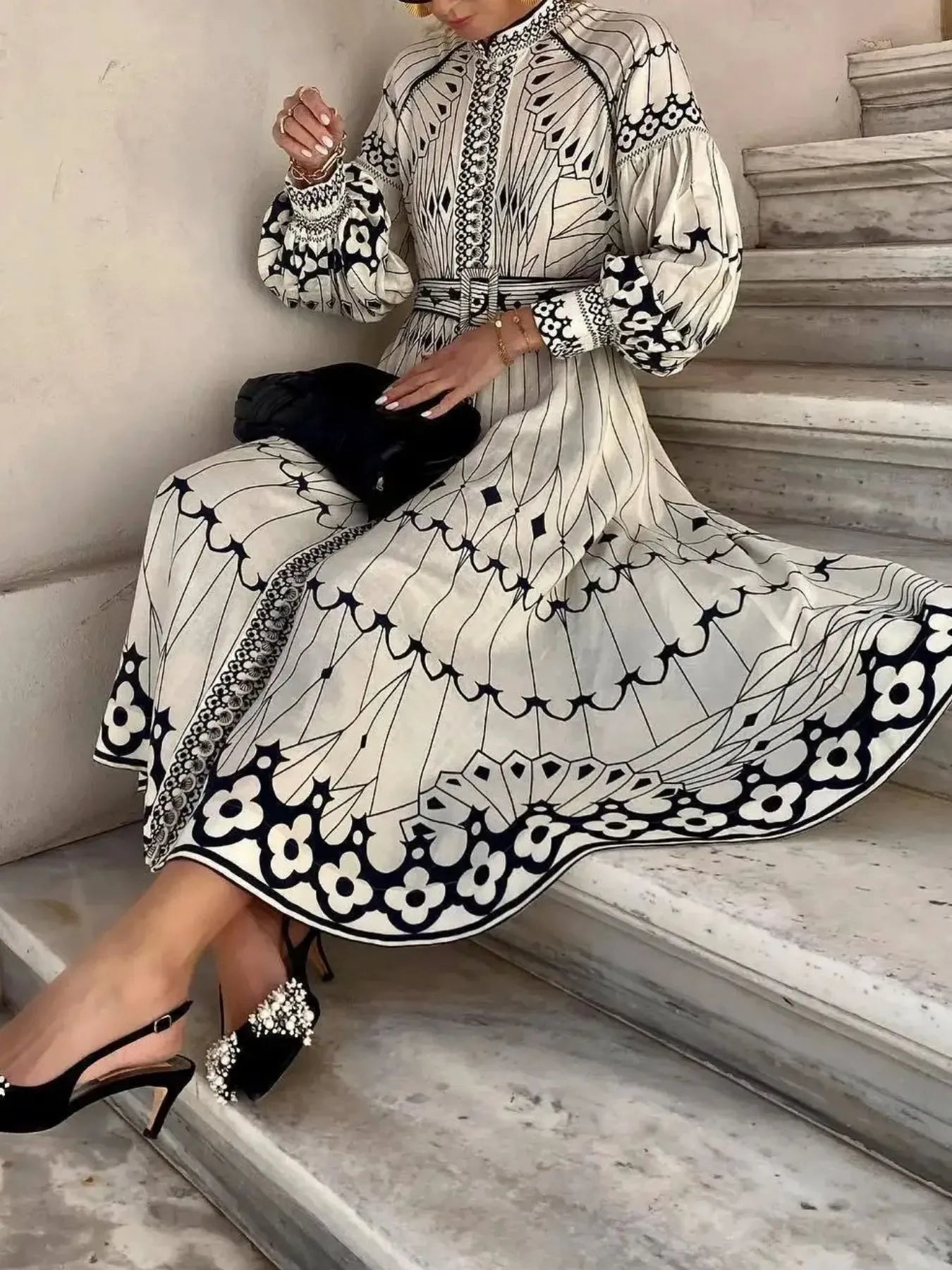 Printed shirt dress with belt from Trendsi, featuring a stylish design, long sleeves, and a flattering fit.
