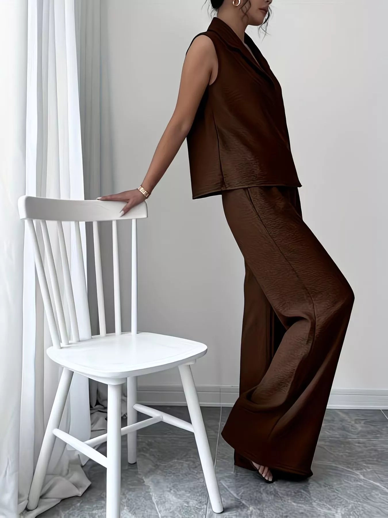 V-neck sleeveless top and wide-leg pants set by Trendsi, featuring a stylish, coordinated outfit with a modern, relaxed fit.