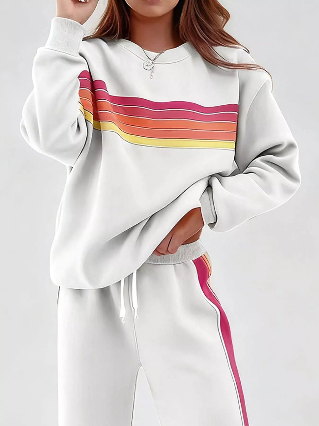 Striped round neck sweatshirt and pants set by Trendsi, casual loungewear with blue and white horizontal stripes, front view.