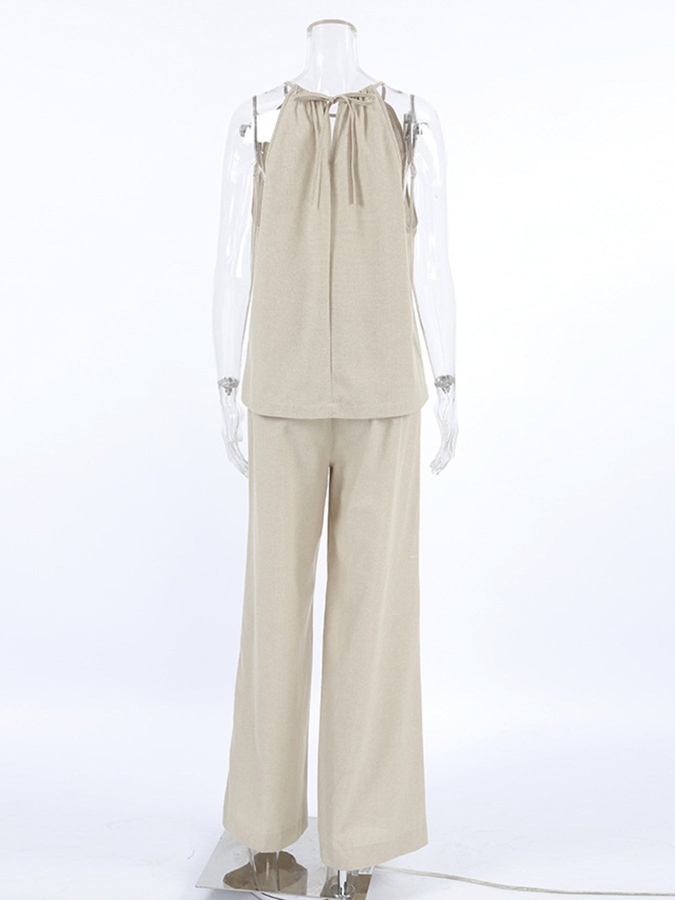 Trendsi cutout tank top and wide leg pants set, featuring a stylish crop top with cutout details and flowy, high-waisted wide-leg pants.