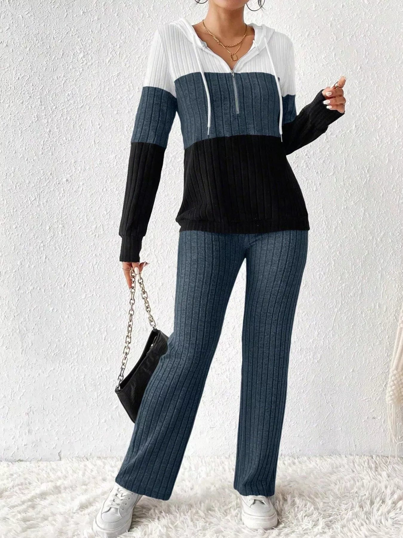 Color block half zip hooded top and matching pants set by Trendsi, featuring vibrant color blocking and comfortable fit.