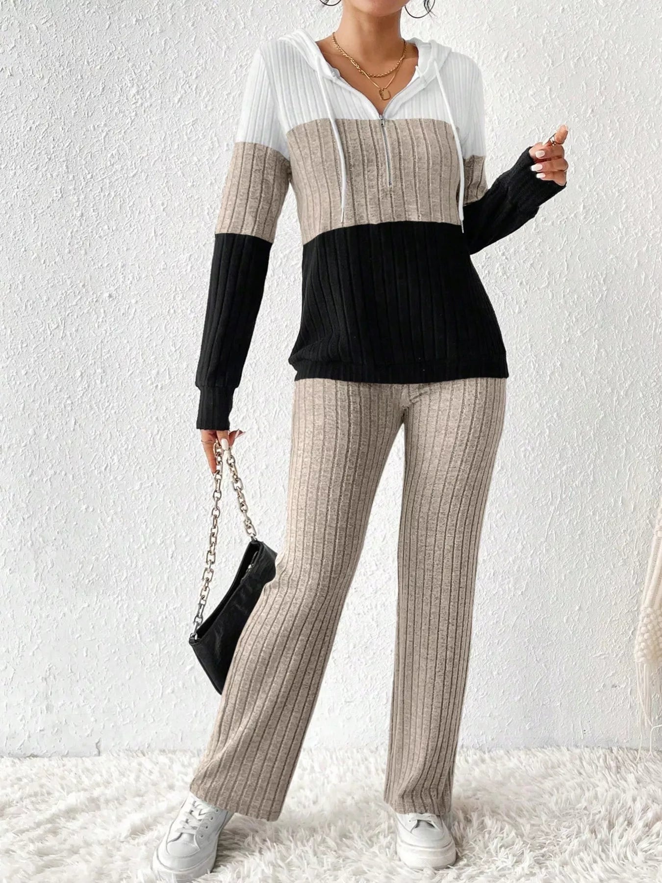 Color block half-zip hooded top and matching pants set by Trendsi, featuring bold color blocks and comfortable fit.