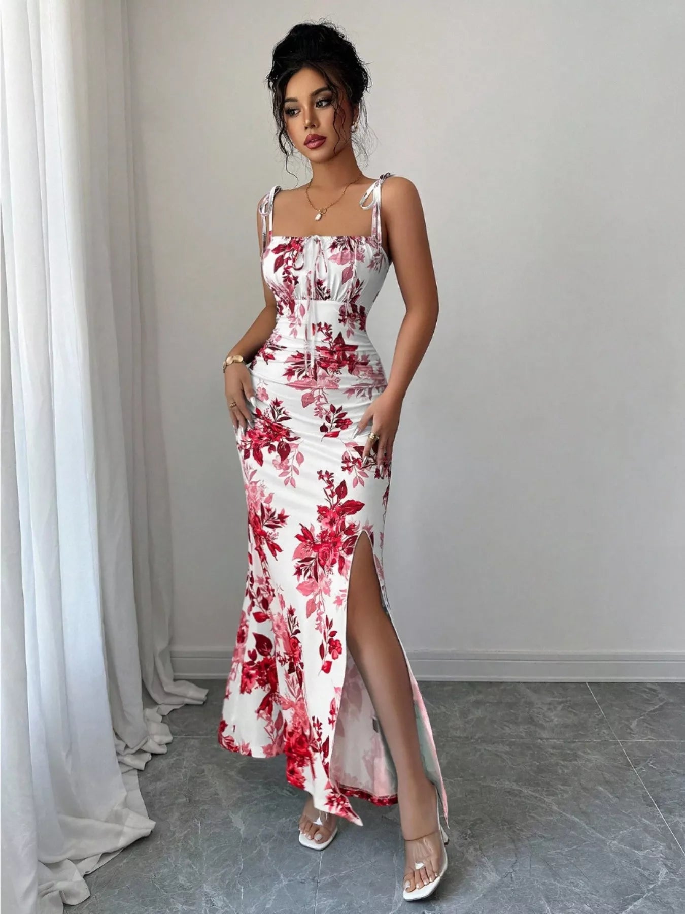 Printed tie-strap slit maxi dress by Trendsi featuring a flowing silhouette and bold print, perfect for summer or special occasions.