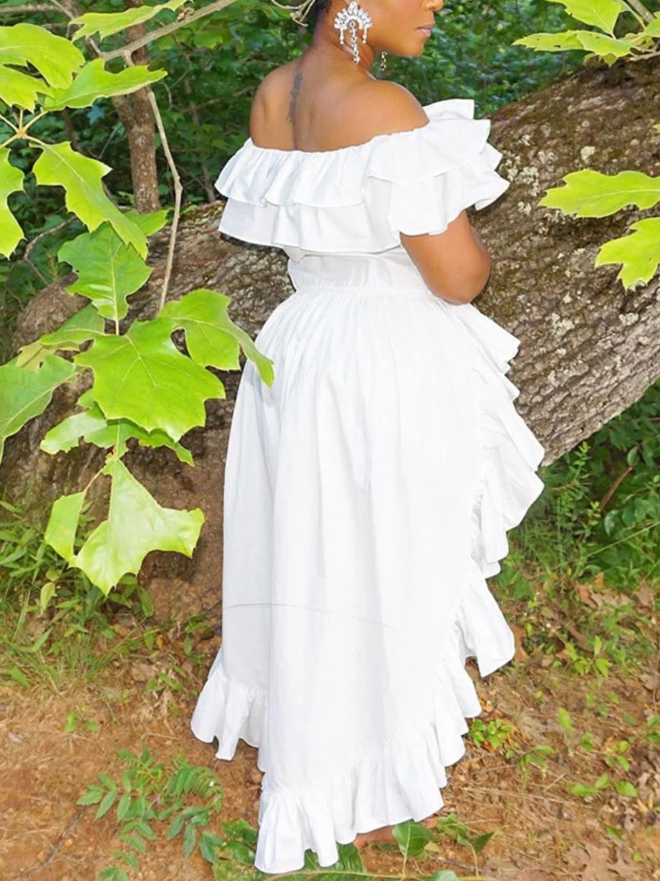 Ruffle off-shoulder high-low blouse from Trendsi featuring billowy sleeves and a flowy hem, perfect for stylish casual wear.