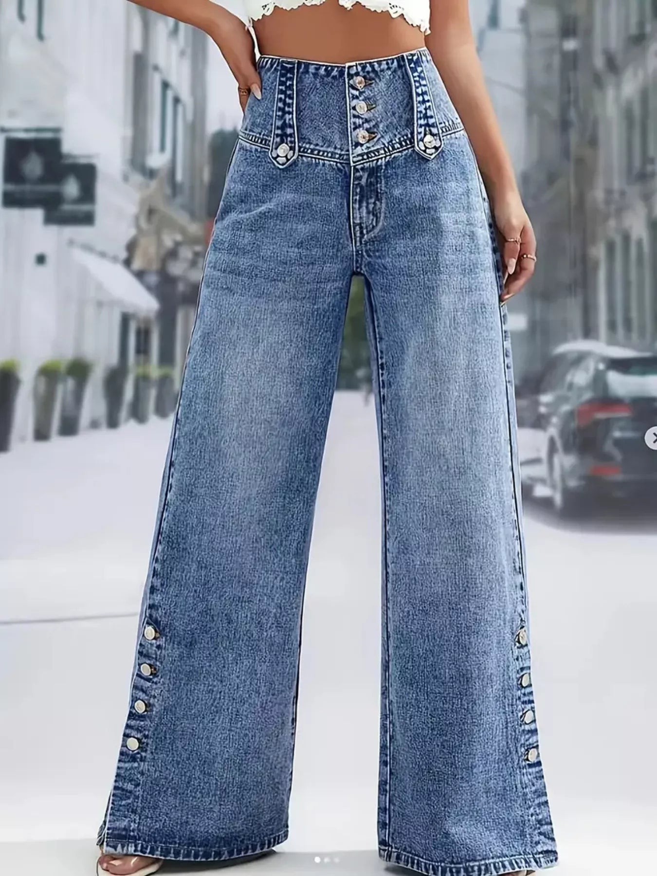 High waist denim jeans with button decor and wide-leg style from Trendsi, shown in a natural pose highlighting the fit and design.