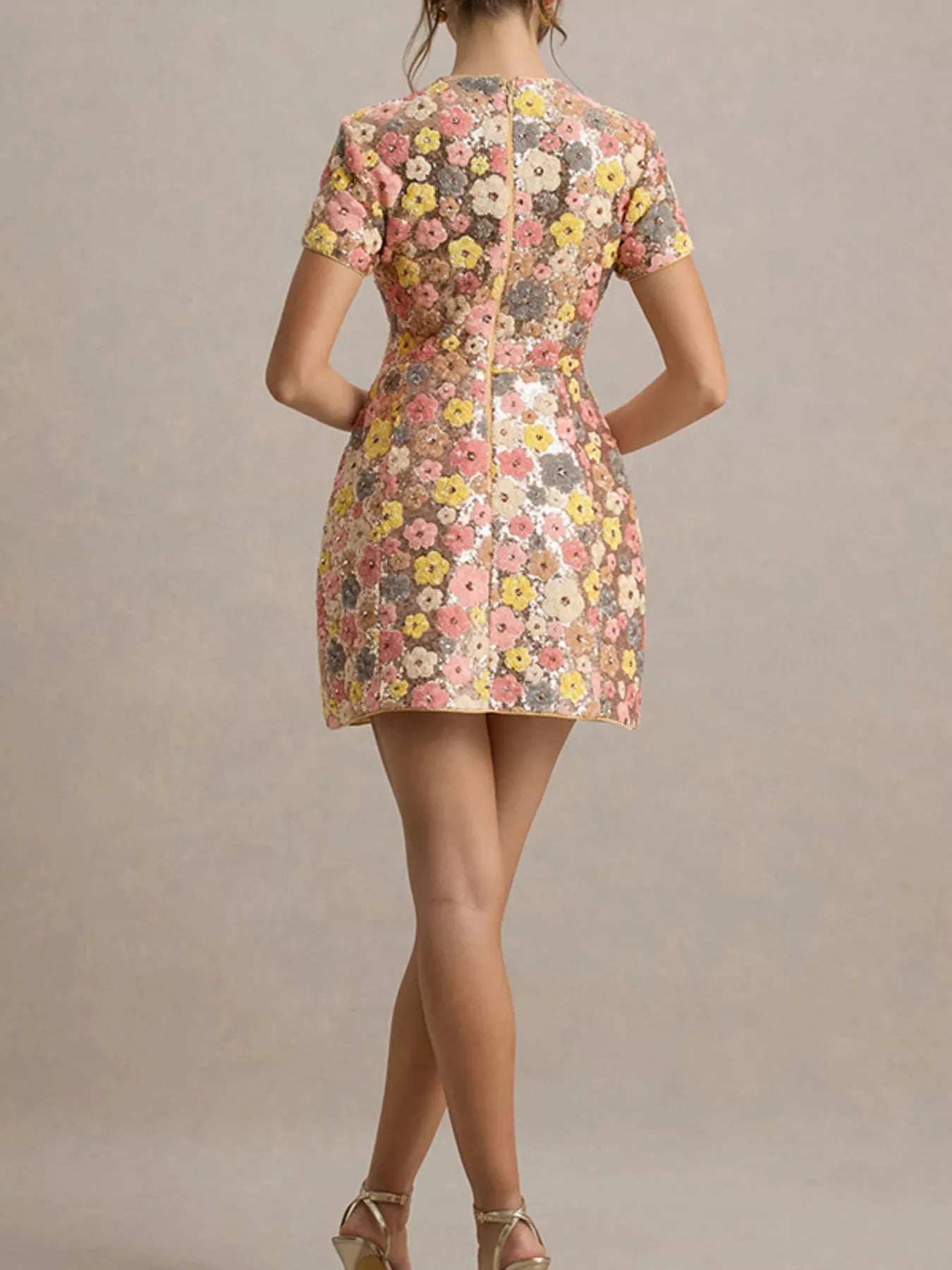 Floral sequin short sleeve mini dress from Trendsi featuring colorful floral patterns and shimmering sequin details.