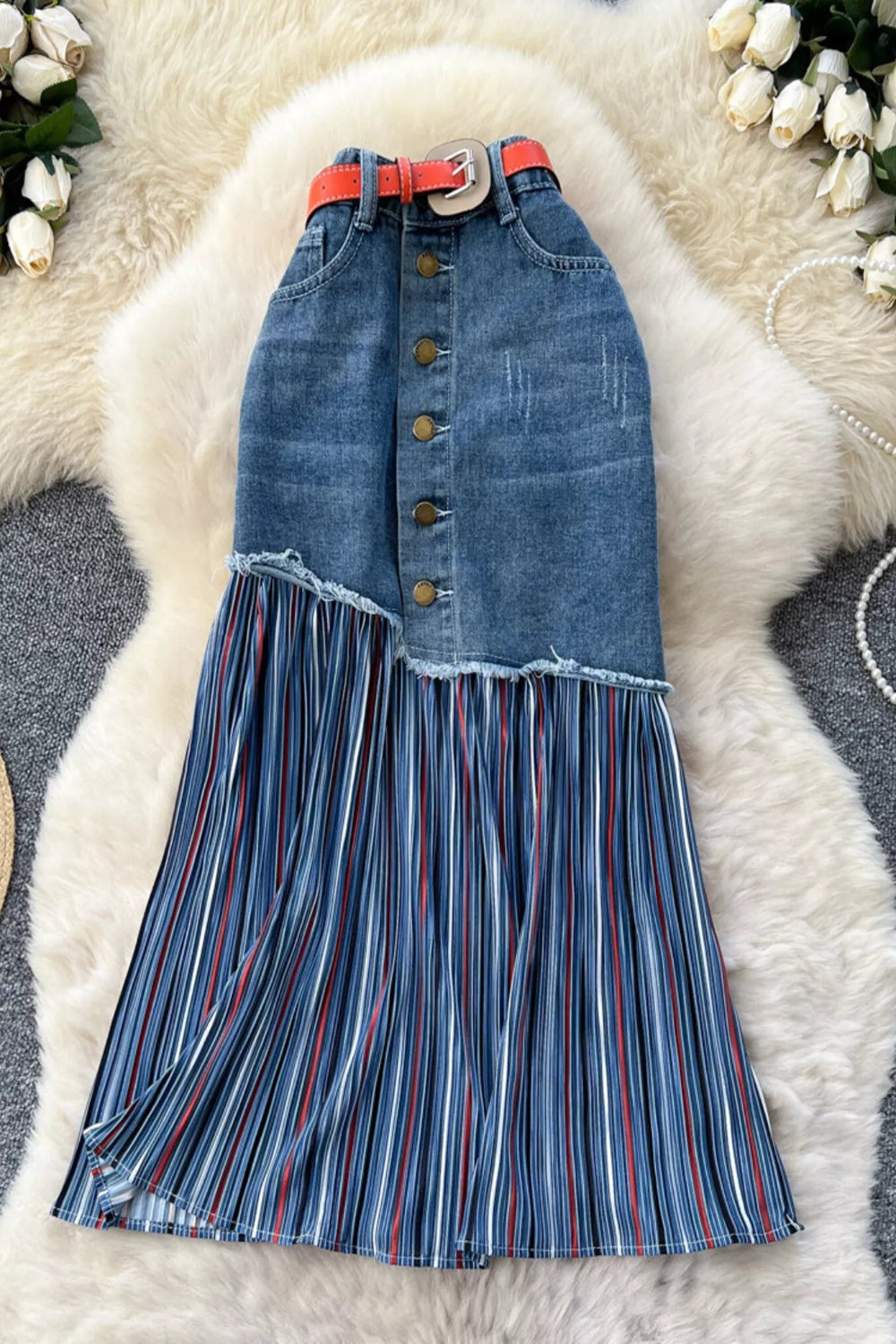 Striped patchwork denim skirt from Trendsi featuring multicolored striped patchwork design and classic denim fabric.