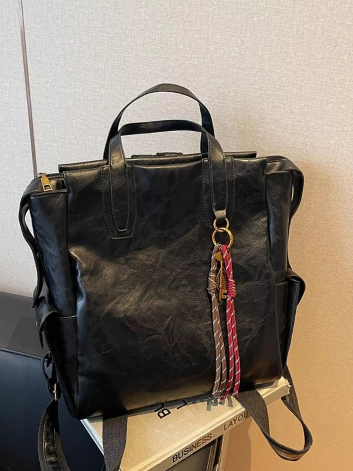 Vintage leather convertible backpack bag by Trendsi, showing the stylish, distressed leather design with adjustable straps and multiple compartments.