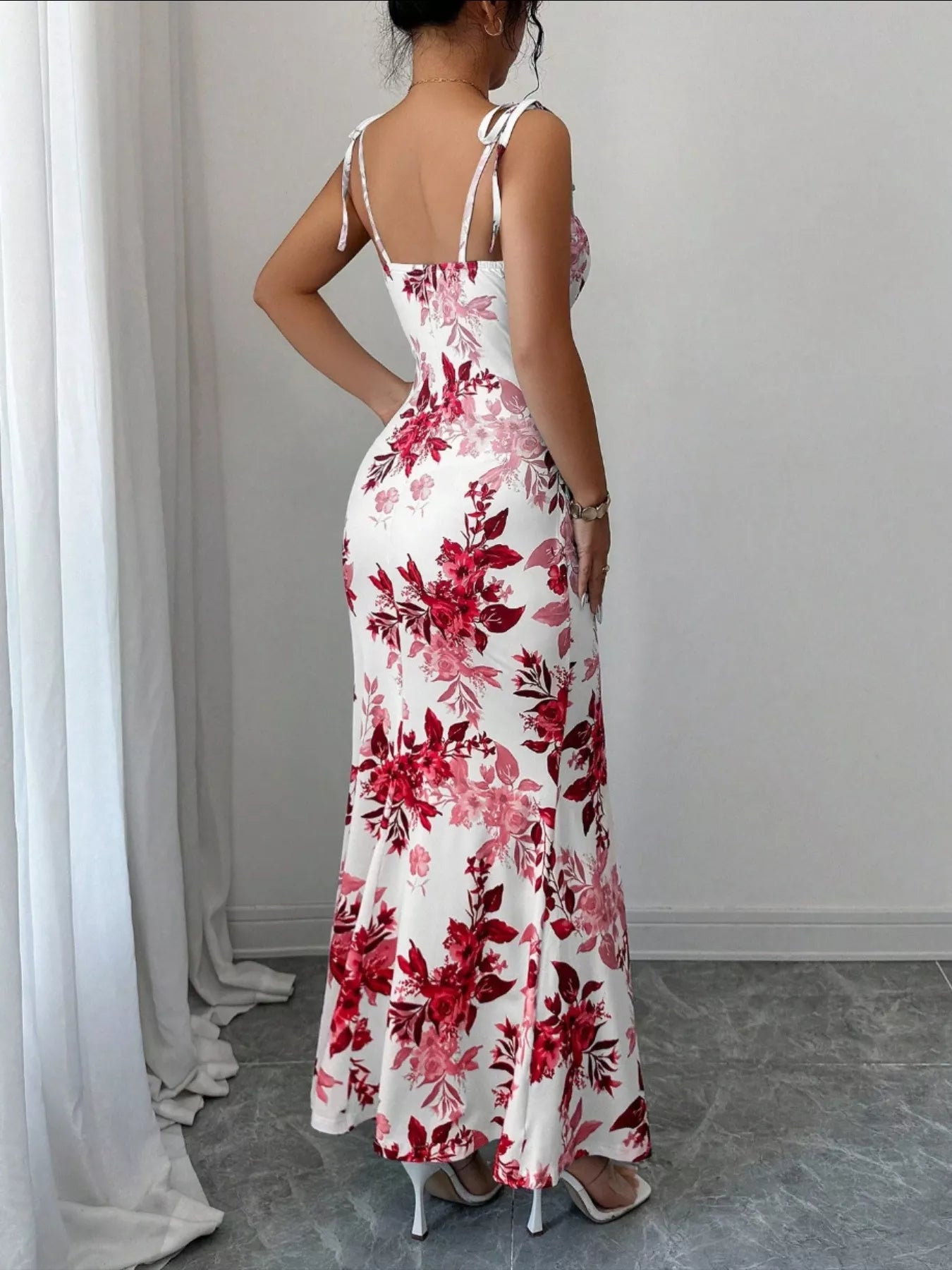 Printed tie strap slit maxi dress from Trendsi featuring a flowing design with a slit and adjustable tie straps.