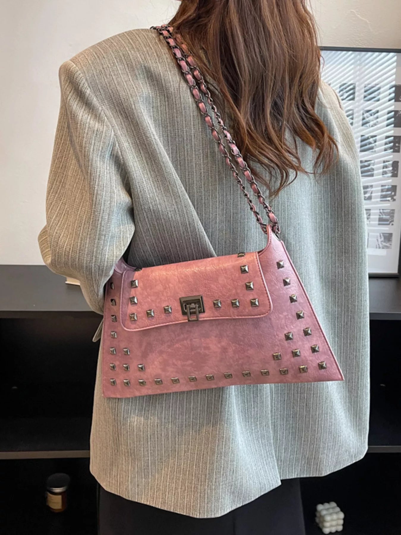 Studded flap chain shoulder bag from Trendsi, featuring a stylish design with chain strap and edgy studded details.