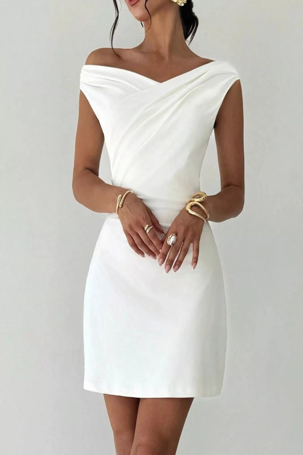 Elegant off-shoulder draped mini dress from Trendsi, perfect for after 5 occasions, featuring stylish fabric and flattering fit.