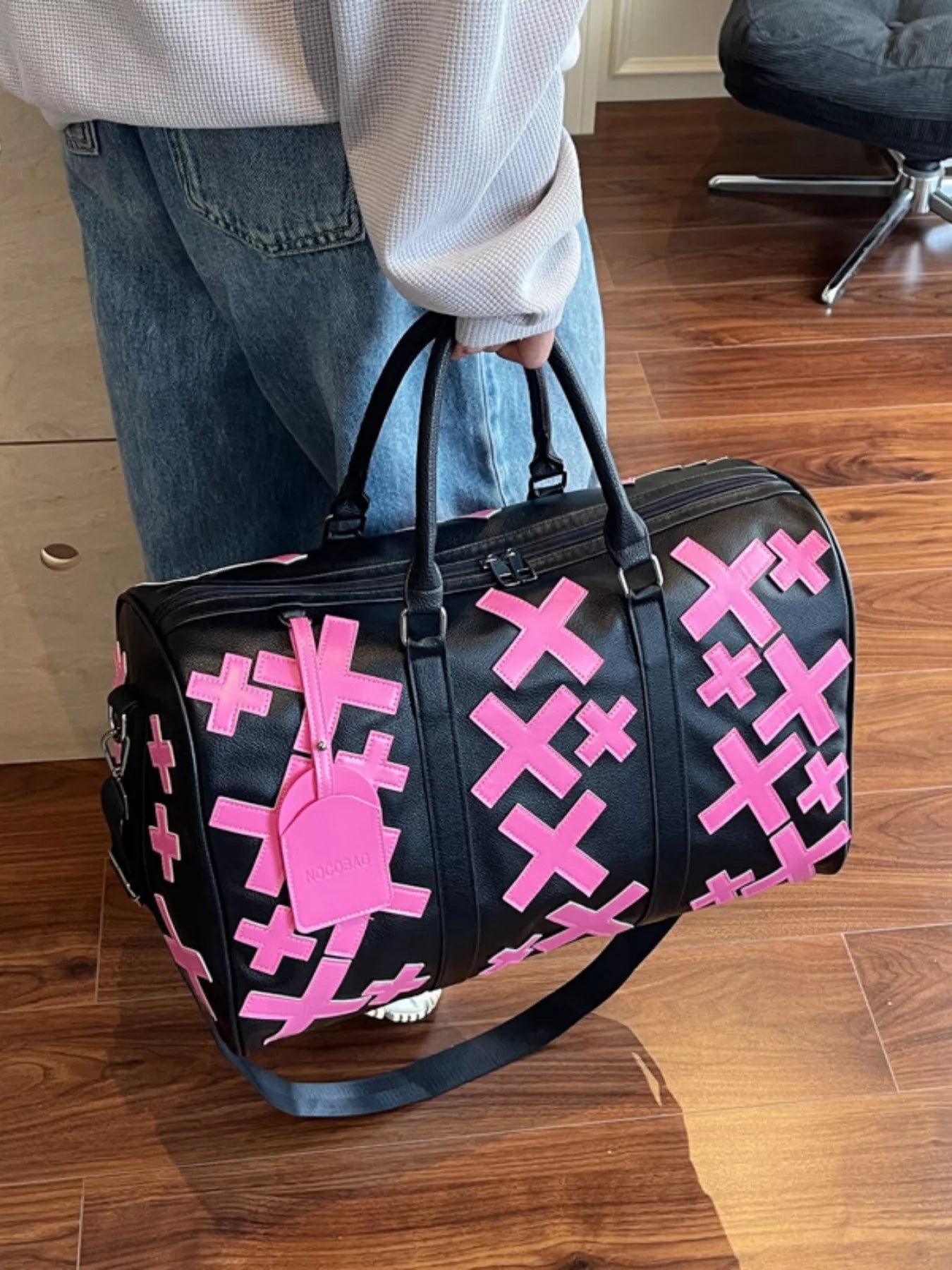 Colorful cross pattern travel duffel bag from Trendsi, showcasing vibrant design and spacious handbag style for travel or daily use.