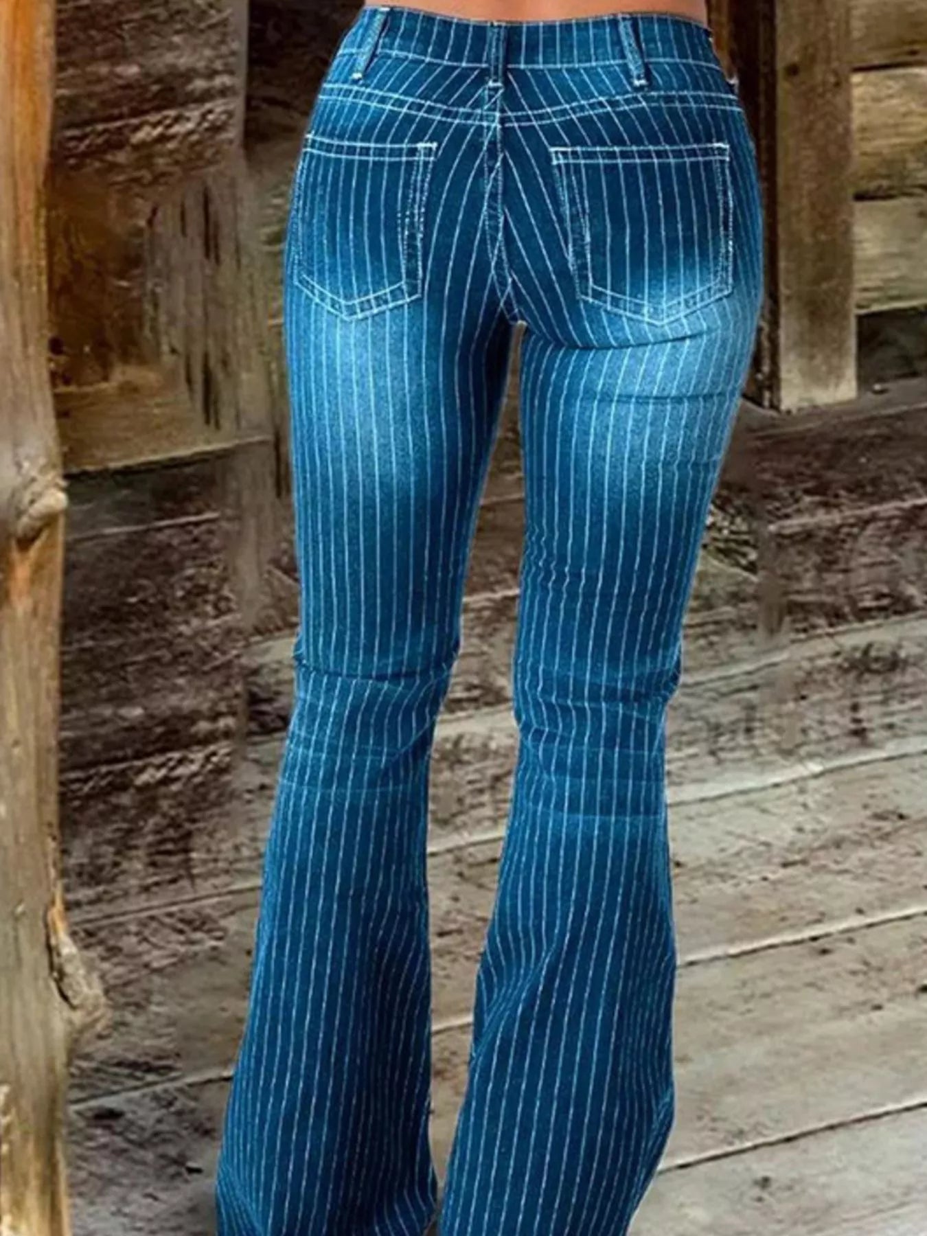Striped button fly flare jeans in denim from Trendsi, featuring a high waist, flare silhouette, and bold stripe pattern.