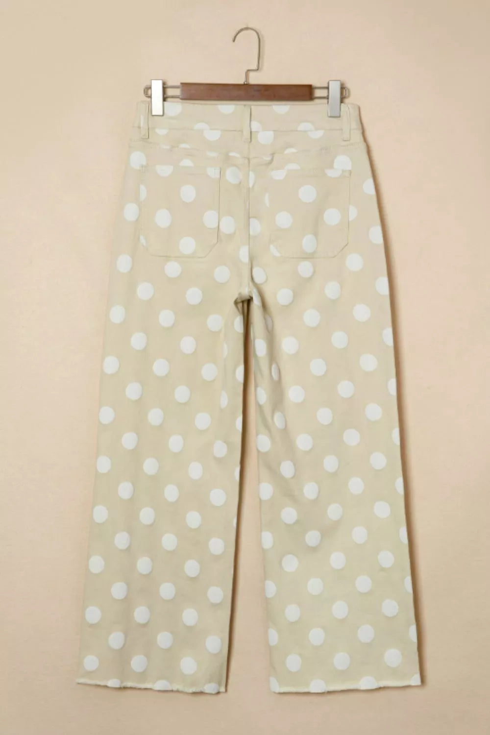 Polka dot high-waisted wide-leg jeans from Trendsi, featuring a playful pattern and relaxed fit, shown on a model.