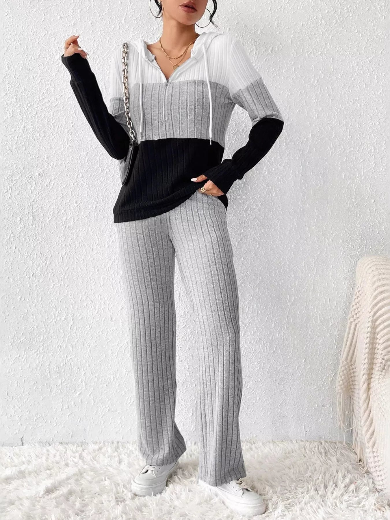 Color block half zip hooded top and matching pants set by Trendsi, featuring bold color panels and comfortable casual style.