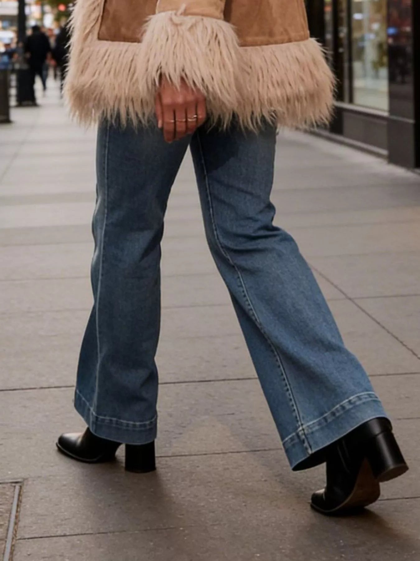 High-waisted flare leg denim jeans by Trendsi, showing the fit and style on a model with front and back views.