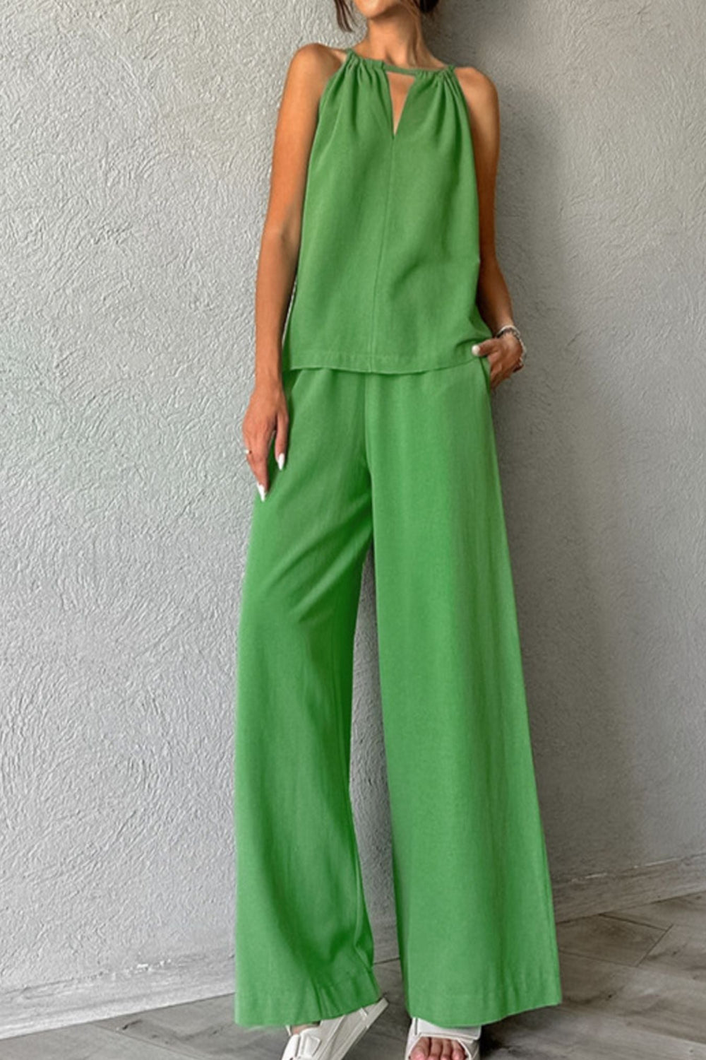 Trendsi cutout tank top and wide-leg pants set, featuring a stylish sleeveless top with cutout details and flowy wide-leg trousers.
