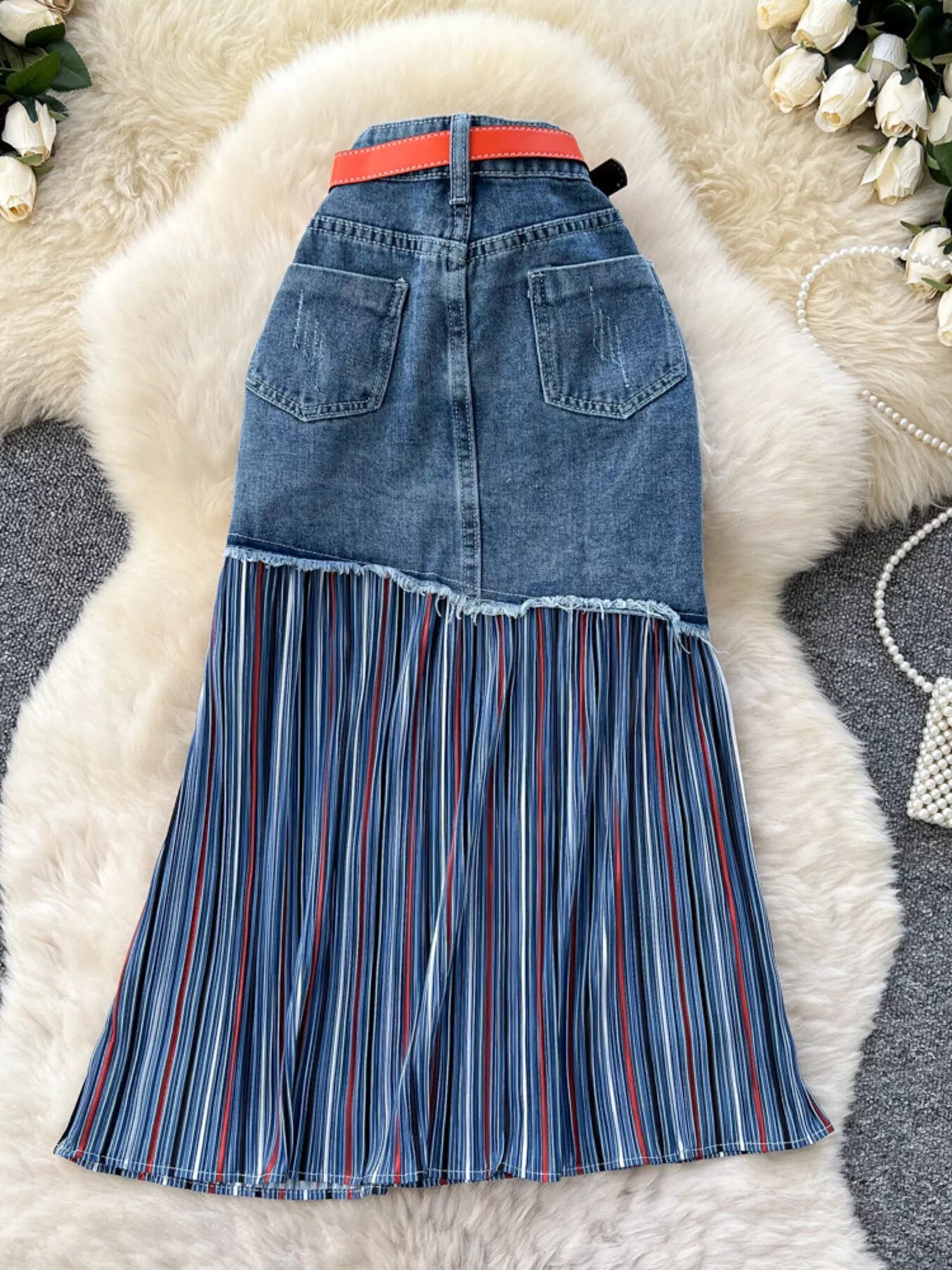 Striped patchwork denim skirt from Trendsi featuring multicolored striped patchwork design and classic denim fabric.