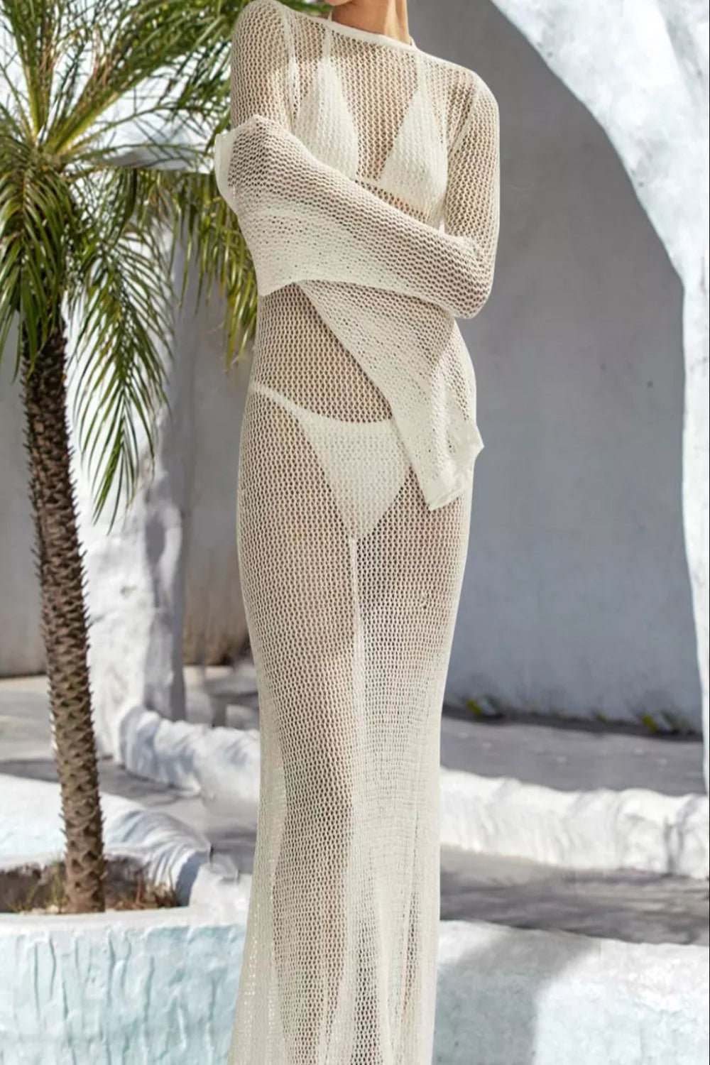 Backless flare sleeve swimwear cover-up dress by Trendsi, featuring flowy fabric and stylish design for beach or poolside wear.