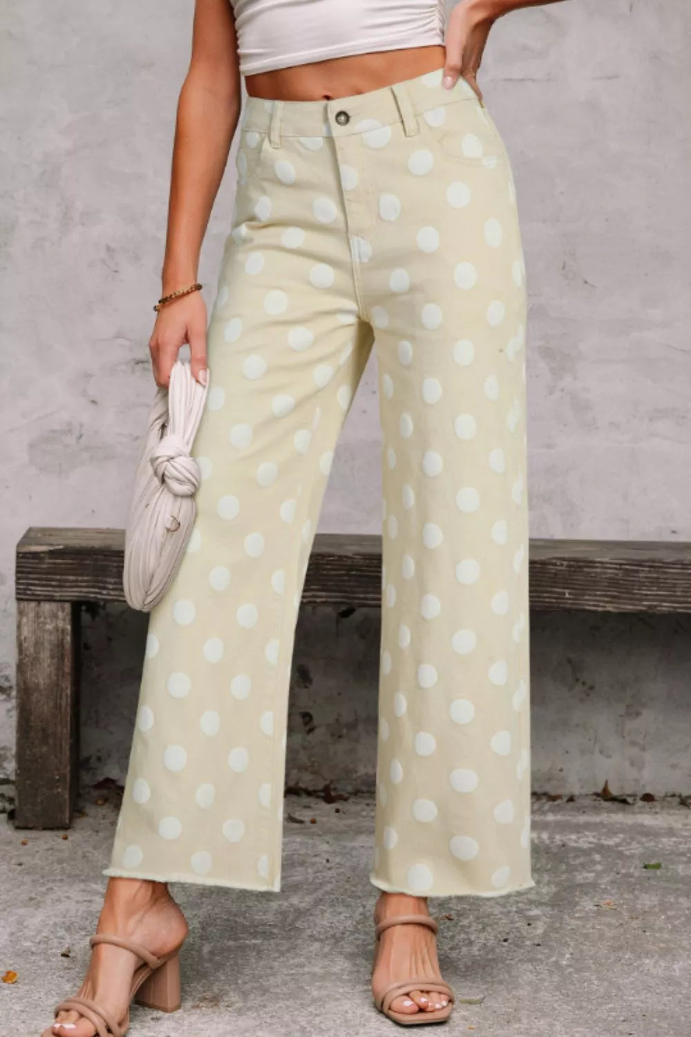 Polka dot high-waisted wide-leg jeans from Trendsi featuring a bold polka dot pattern and relaxed fit.