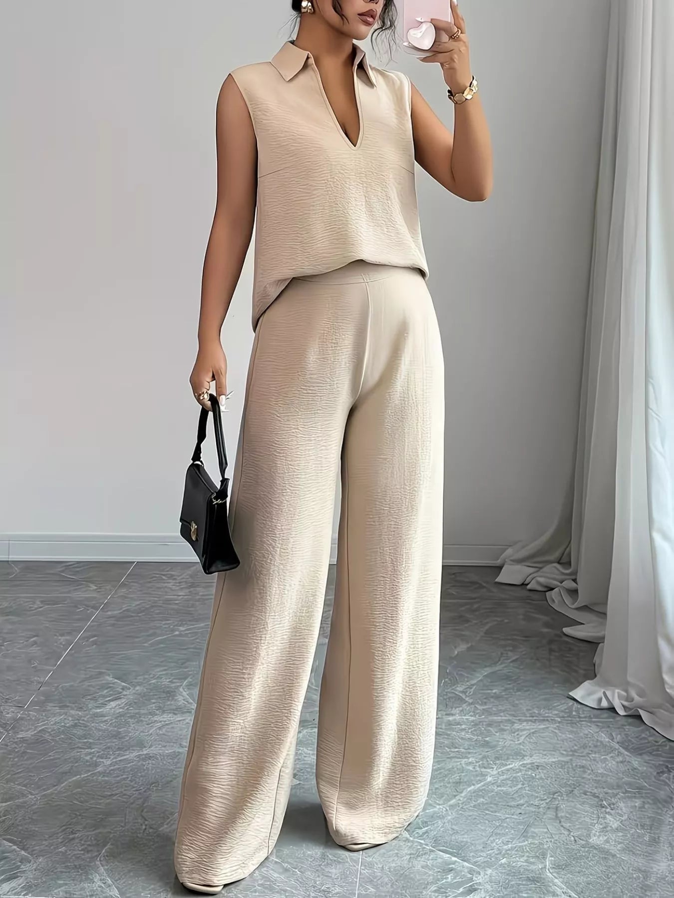 V-neck sleeveless top and wide-leg pants set by Trendsi, shown in a stylish, coordinated outfit on a model.