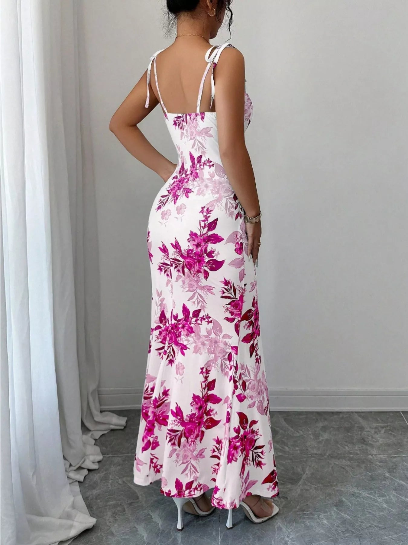 Printed tie-strap slit maxi dress by Trendsi featuring a flowy design with a slit and adjustable tie straps.