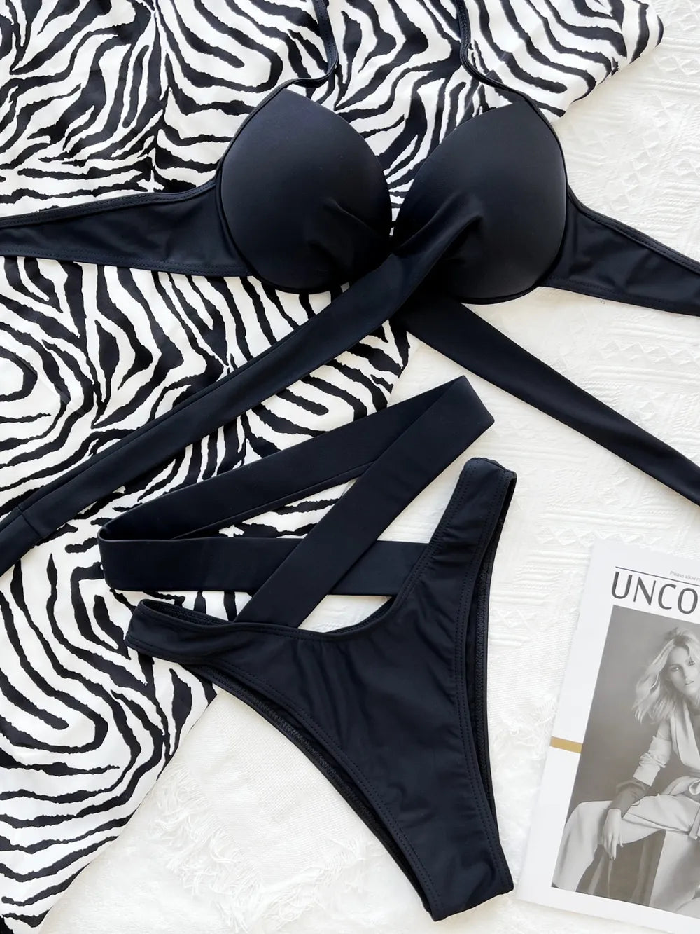 Crisscross halter neck bikini top and matching bottoms from Trendsi swimwear set, featuring a stylish crisscross design and supportive fit.