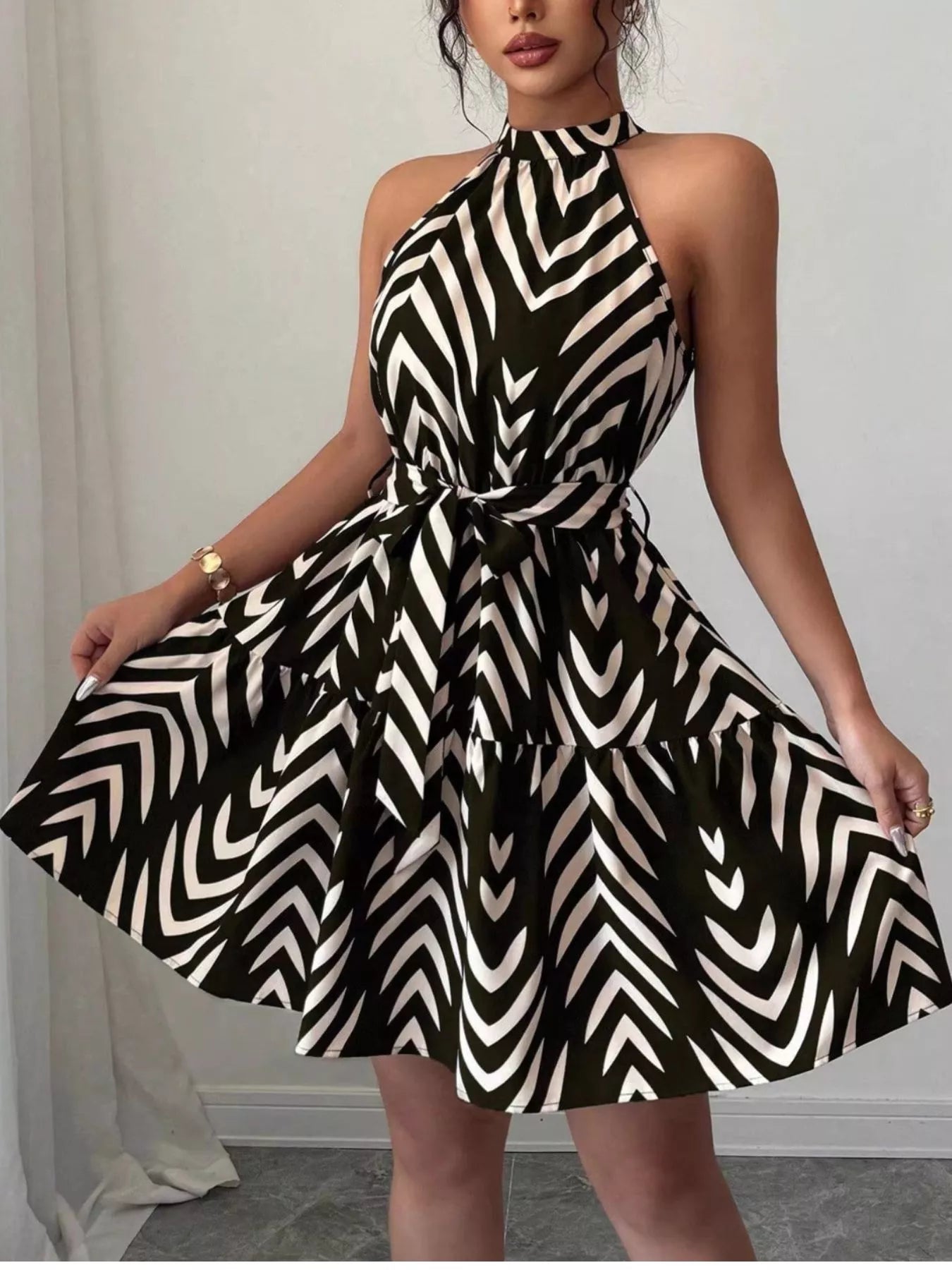 Zebra print halter neck dress with tie waist and ruffle hem from Trendsi, styled on a mannequin.