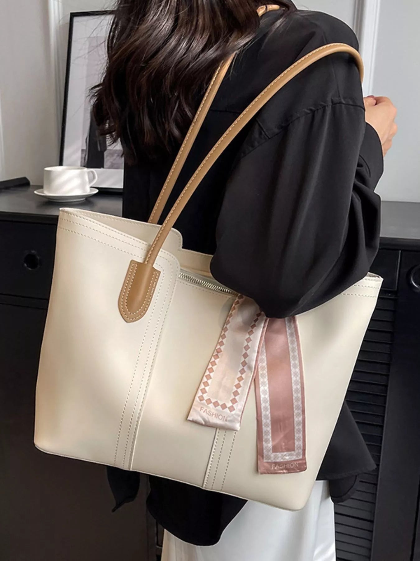 Casual tote shoulder handbag by Trendsi, featuring a spacious design with sturdy handles and stylish neutral color.