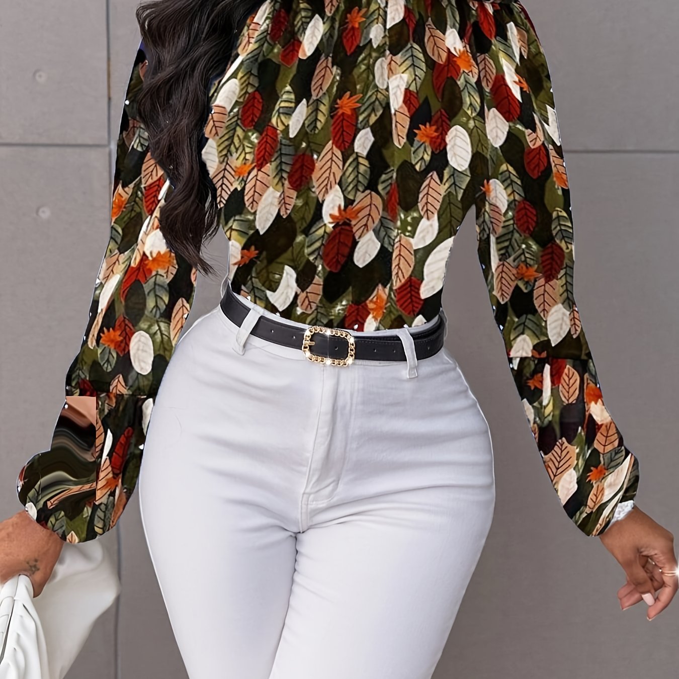 Nature-inspired blouse by Toshe Women's Fashions featuring floral patterns and lightweight fabric, displayed on a hanger.