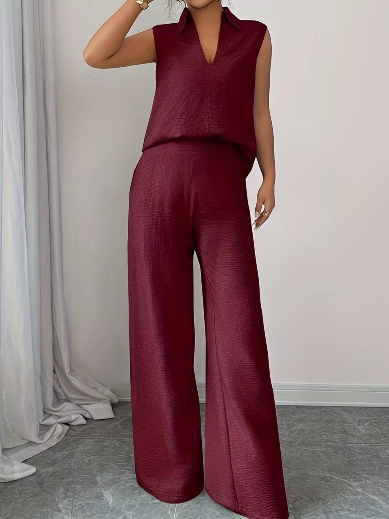V-neck sleeveless top and wide-leg pants set by Trendsi, shown in a stylish, coordinated outfit with a modern, relaxed fit.